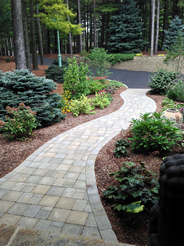 Photo of a medium sized classic front fully shaded garden in Chicago with a garden path and brick paving.