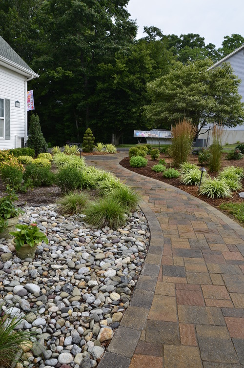 Landscaping Ideas for Instant Curb Appeal; Landscape design ideas that will help your house stand out from the neighbors. The easy, low-cost, and smart ways to create curb appeal - New walkway using Belgard Urbana pavers with a Dublin Rectangle border.