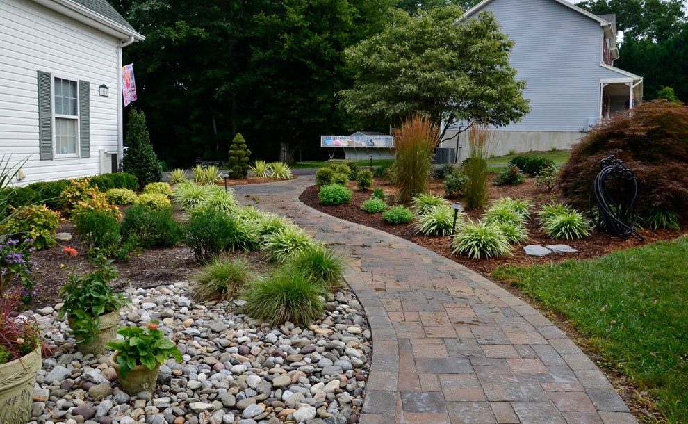 Photo of a large traditional partial sun backyard stone garden path in DC Metro for spring.