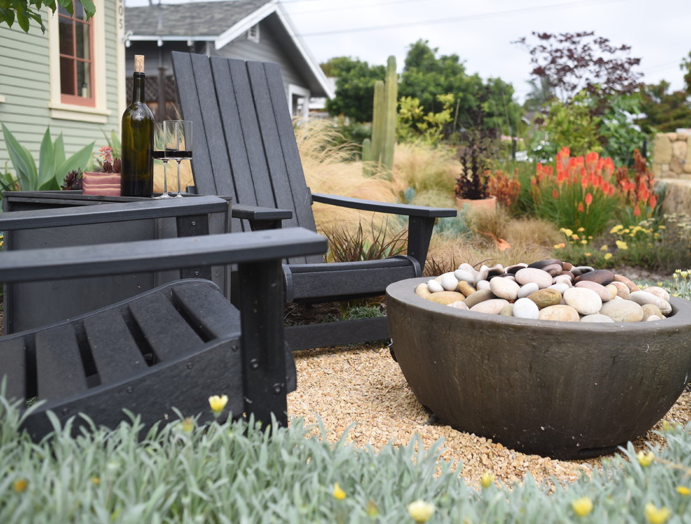 Photo of a small coastal front xeriscape full sun garden in Santa Barbara with a fire feature and gravel.