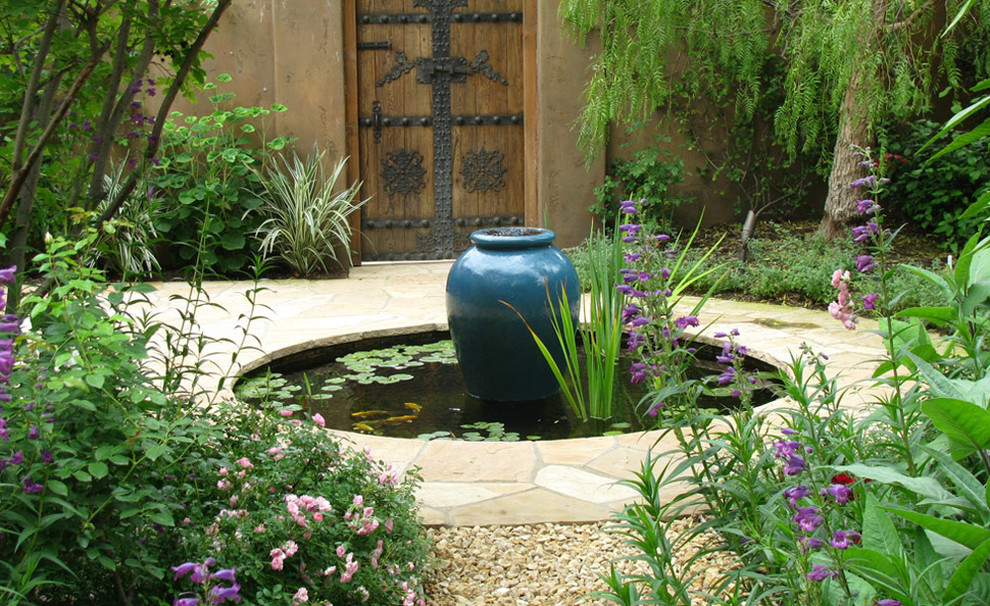Design ideas for an eclectic garden in Los Angeles with a water feature.