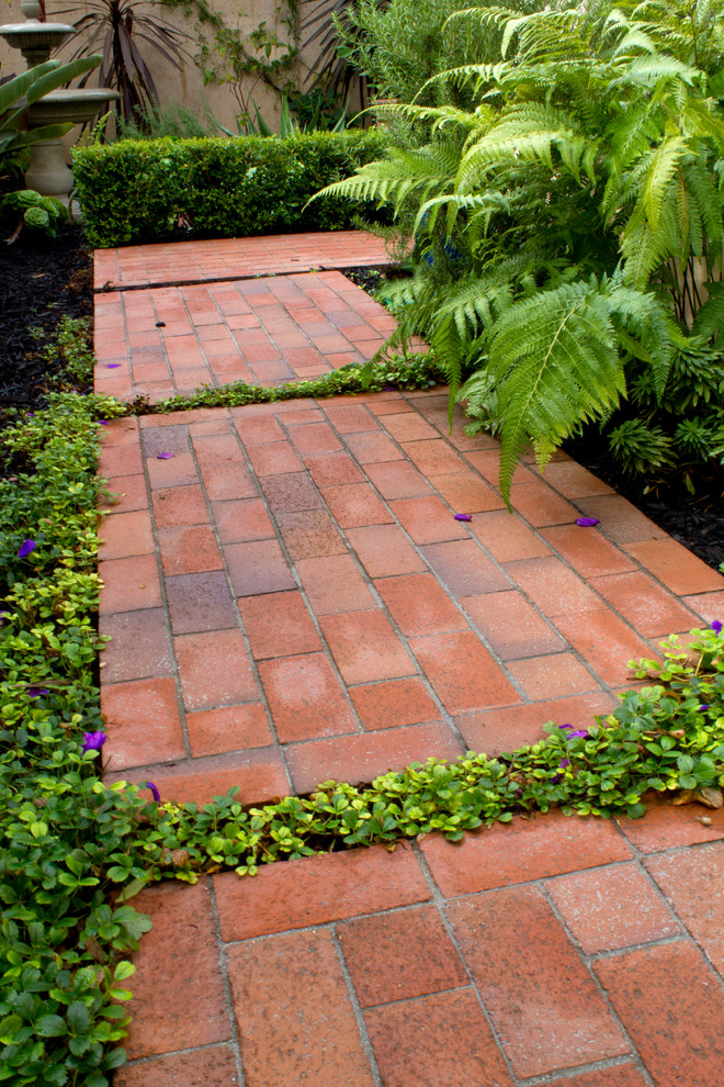 Design ideas for a small mediterranean shade courtyard brick landscaping in Santa Barbara for summer.