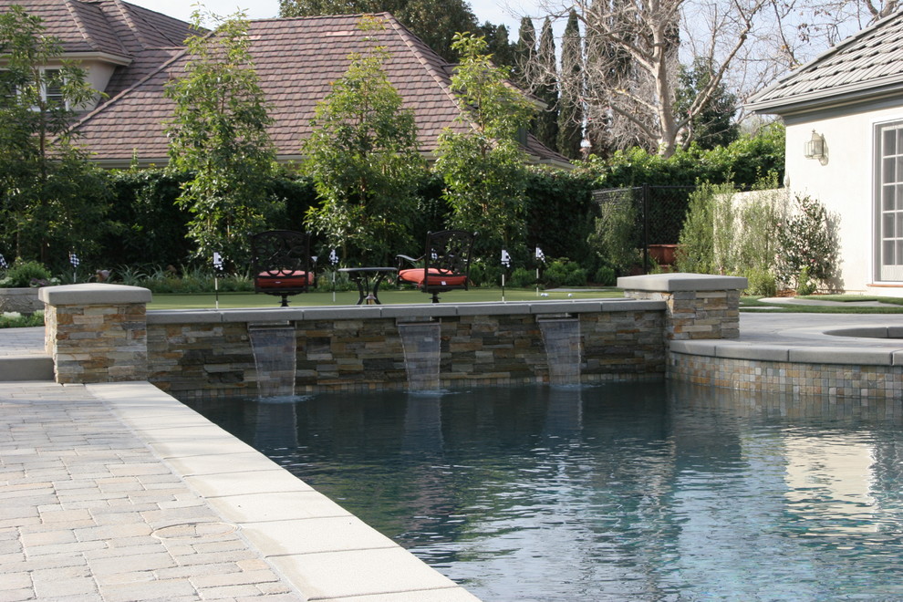 Inspiration for a large mediterranean back full sun garden in San Diego with concrete paving.