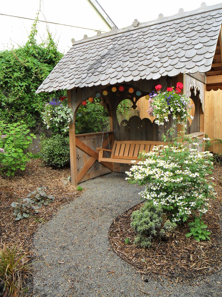 Design ideas for a small eclectic full sun backyard gravel landscaping in Portland.