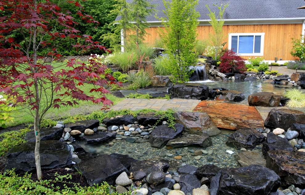Design ideas for a traditional water fountain landscape in Seattle.
