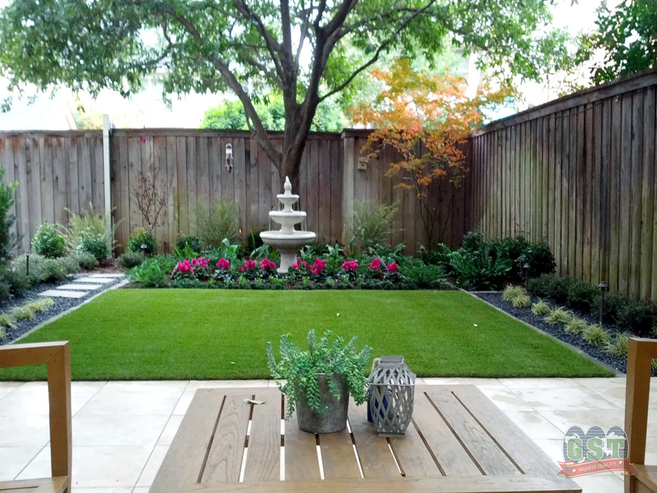 Immagine di un giardino formale esposto a mezz'ombra di medie dimensioni e in cortile in estate con pavimentazioni in cemento