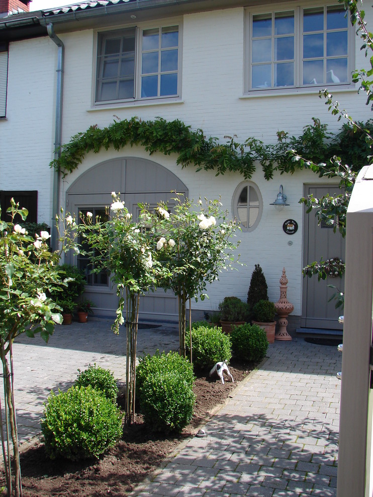 Inspiration for a traditional brick landscaping in Other for summer.