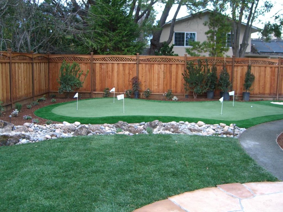 Inspiration for a large traditional drought-tolerant backyard concrete paver landscaping in San Francisco.