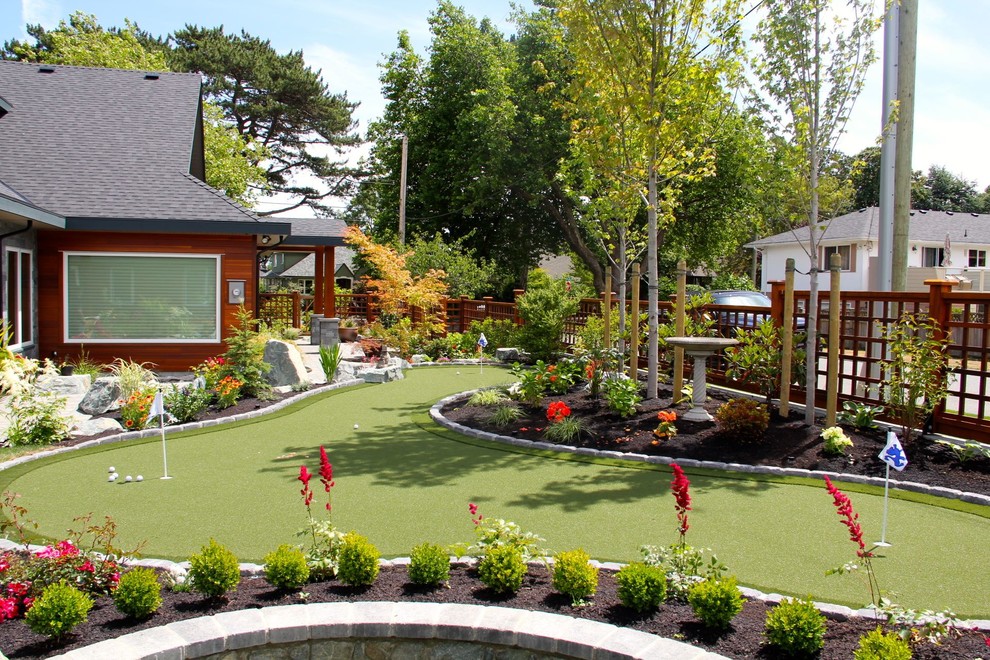 Idee per un giardino american style di medie dimensioni e davanti casa con un muro di contenimento e pavimentazioni in mattoni