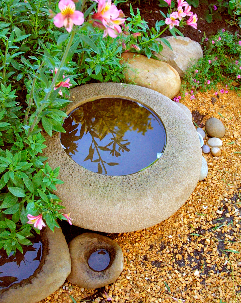 Photo of a traditional garden in Santa Barbara with a water feature.