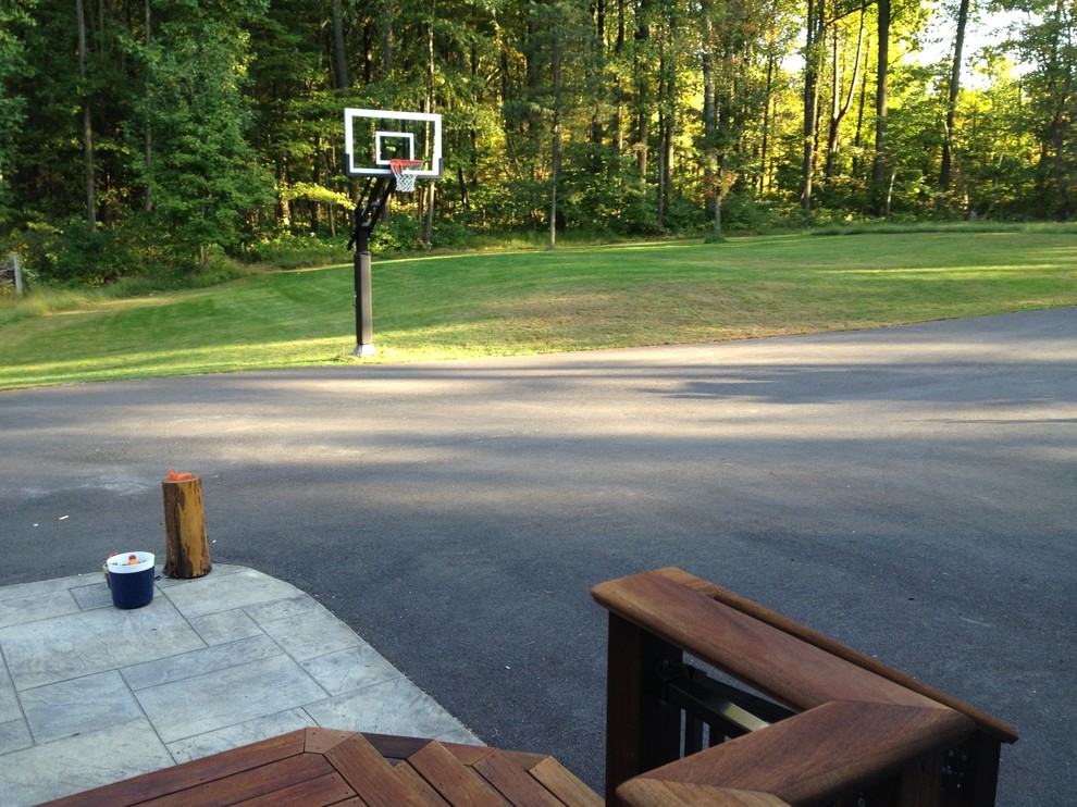 Photo of a large traditional front partial sun garden in Philadelphia with an outdoor sport court.