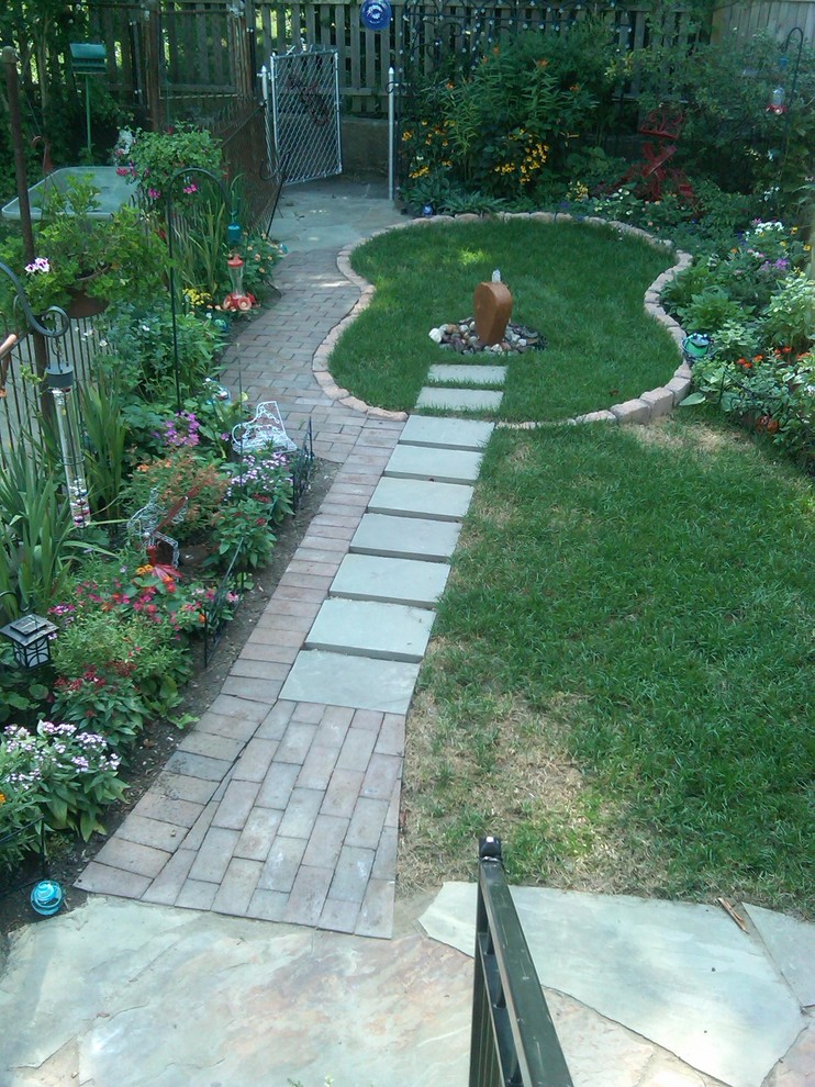 Photo of a bohemian garden in Philadelphia with a water feature.