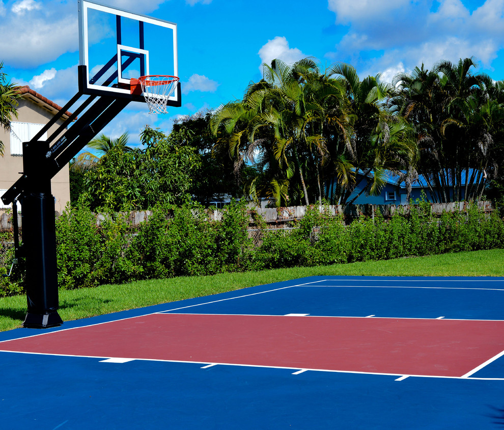 Inspiration for a large traditional partial sun backyard outdoor sport court in Miami.