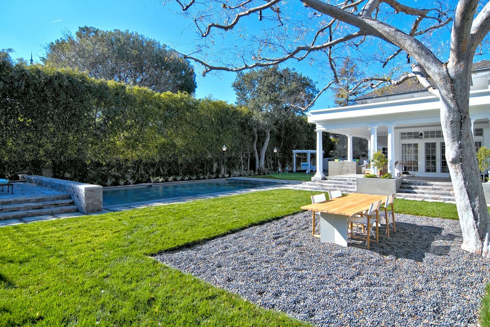 Traditional garden in Orange County with a water feature.