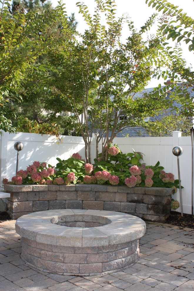 Design ideas for a beach style garden in New York with brick paving.