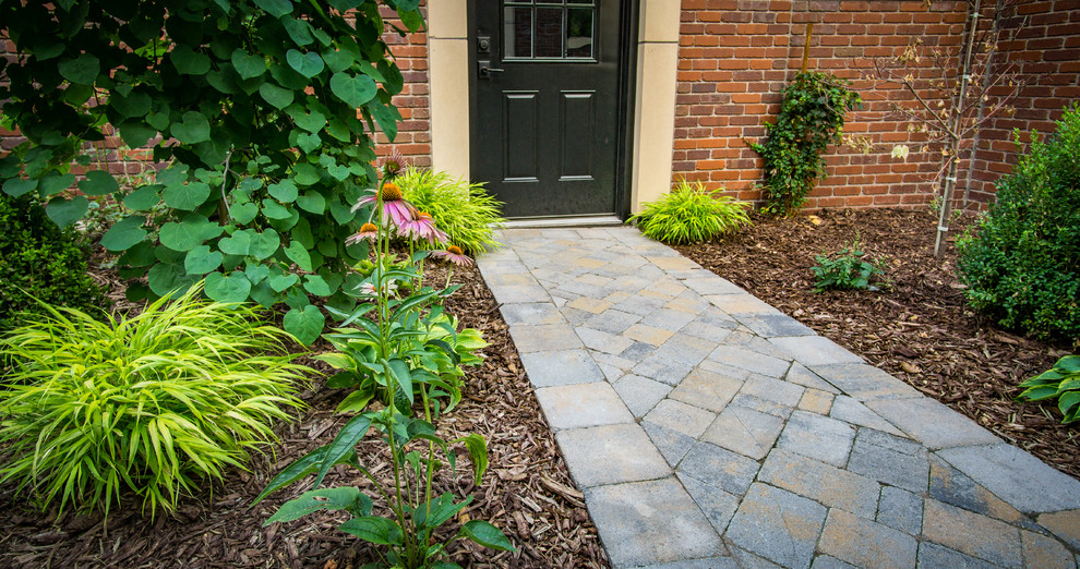 Photo of a medium sized contemporary back garden in Denver with a garden path and natural stone paving.