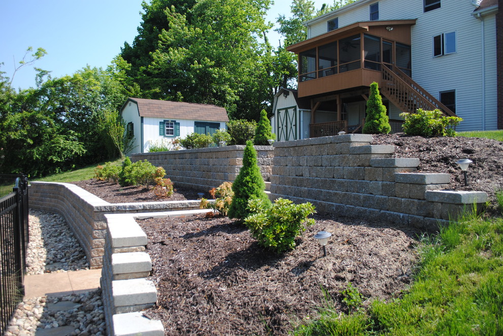 Photo of a traditional backyard concrete paver landscaping in Bridgeport.