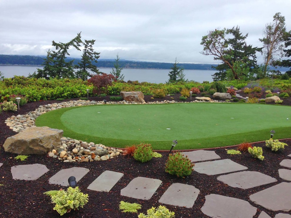 Inspiration for a medium sized contemporary back full sun garden for spring in Seattle with an outdoor sport court, a garden path and natural stone paving.