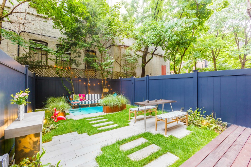 Photo of a small scandi back partial sun garden in New York with concrete paving.