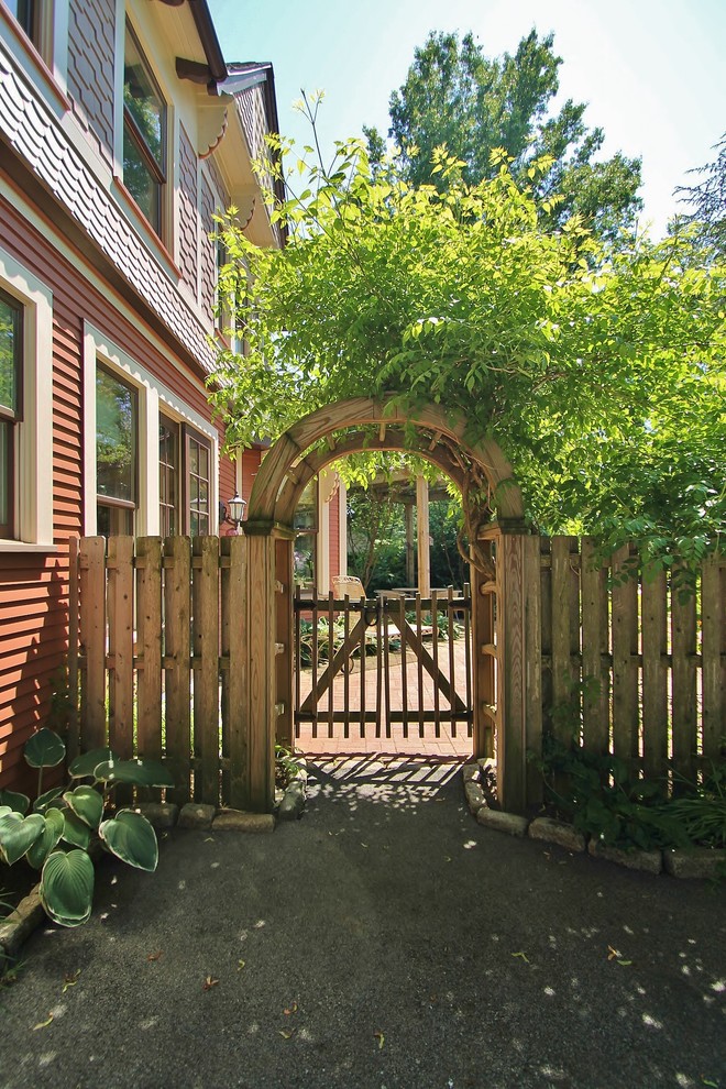 Photo of a traditional shade side yard garden path in Philadelphia.