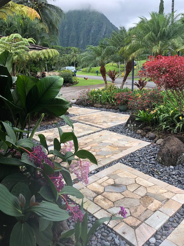 This is an example of a large coastal front yard driveway in Hawaii.