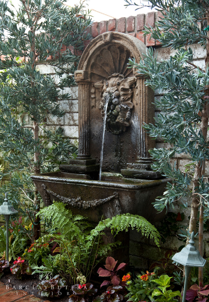 Photo of a coastal shade courtyard brick water fountain landscape in Los Angeles.
