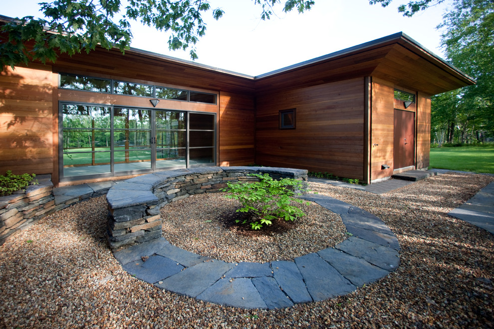 This is an example of a rustic gravel landscaping in Boston.