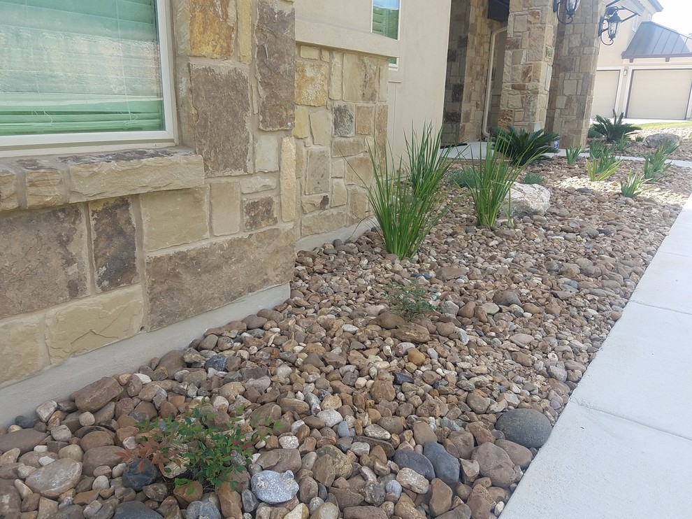Inspiration for a large southwestern drought-tolerant and full sun backyard gravel garden path in Other for summer.