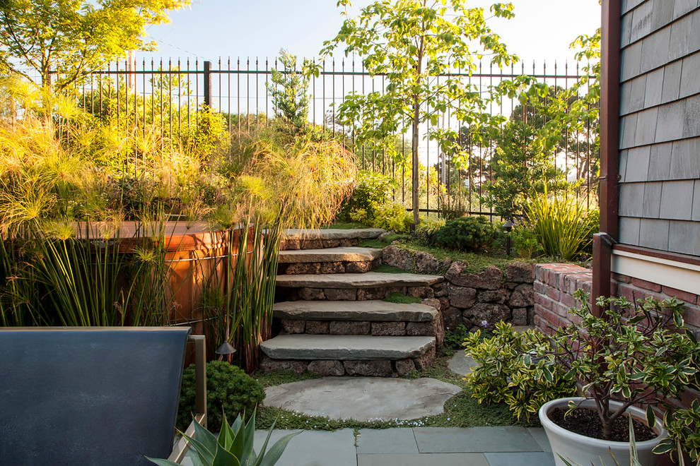 Inspiration for a large craftsman partial sun backyard concrete paver landscaping in San Francisco.