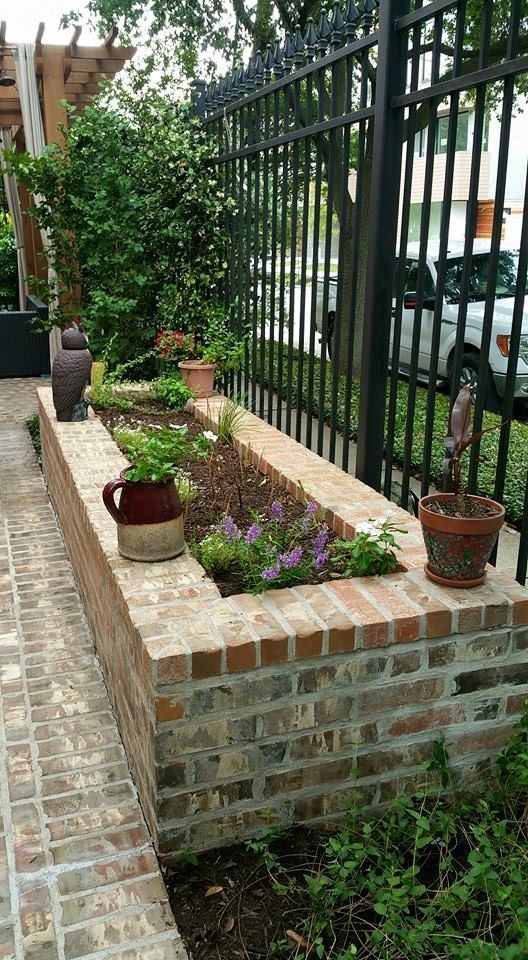 Design ideas for a small contemporary side full sun garden in Houston with a water feature and brick paving.