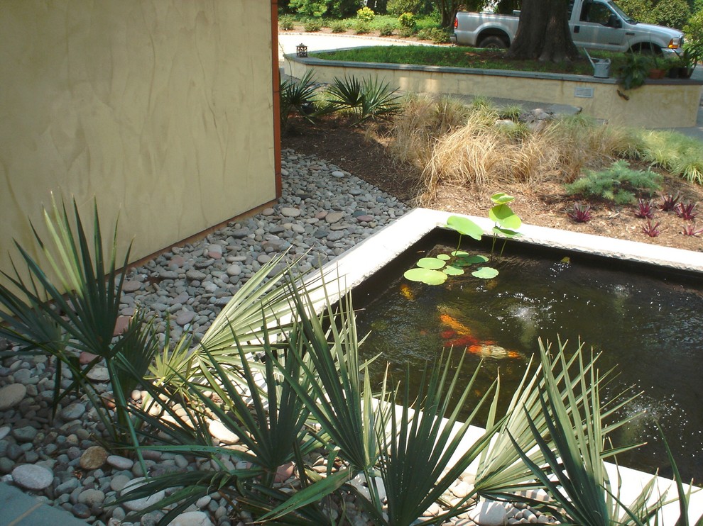 Inspiration for a mid-sized asian partial sun front yard concrete paver pond in Richmond.