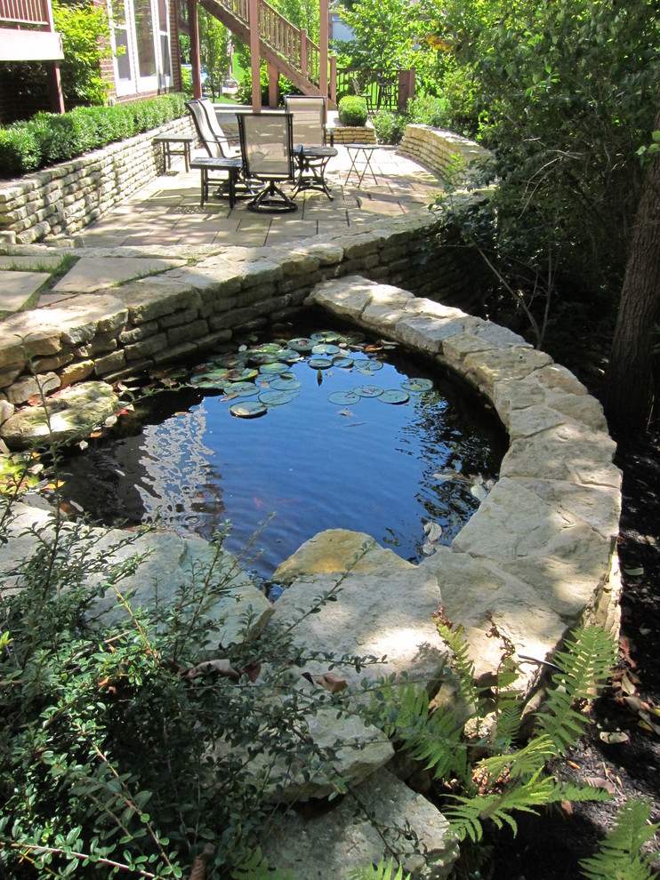 Design ideas for a classic back fully shaded garden in Columbus with a water feature.