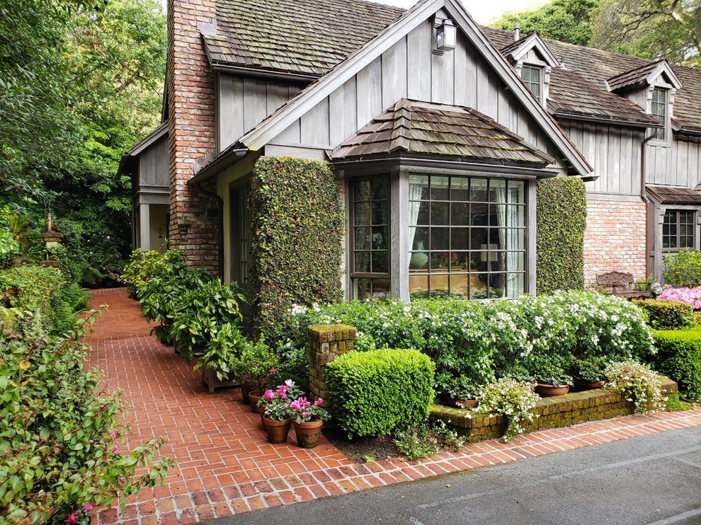 Inspiration for a traditional formal garden in San Francisco with a garden path and brick paving.