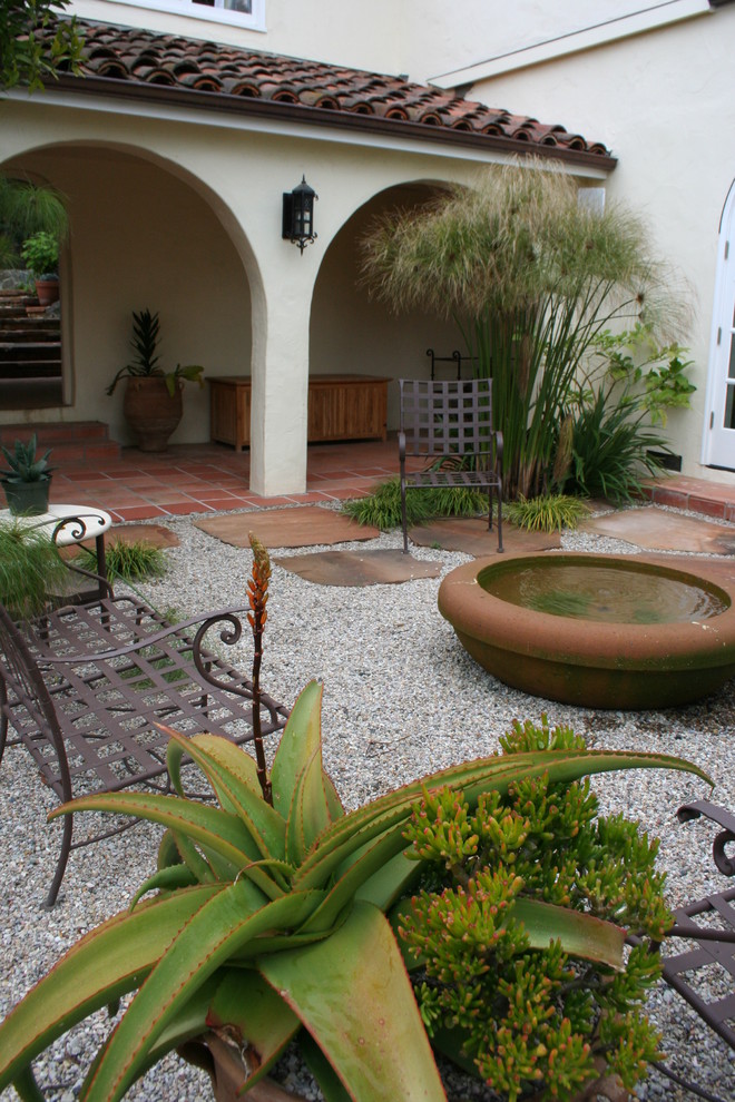 Photo of a mediterranean courtyard garden in San Francisco with a water feature.