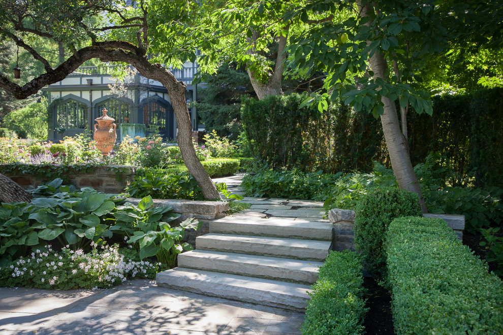 Design ideas for a traditional backyard stone landscaping in Salt Lake City.