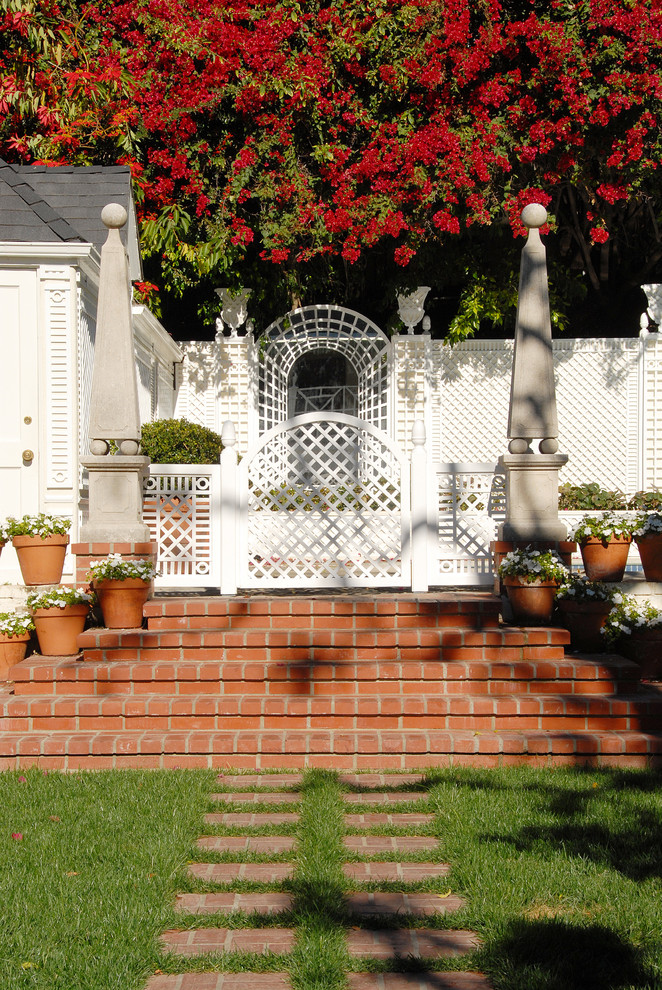 Photo of a traditional hillside brick landscaping in Los Angeles.