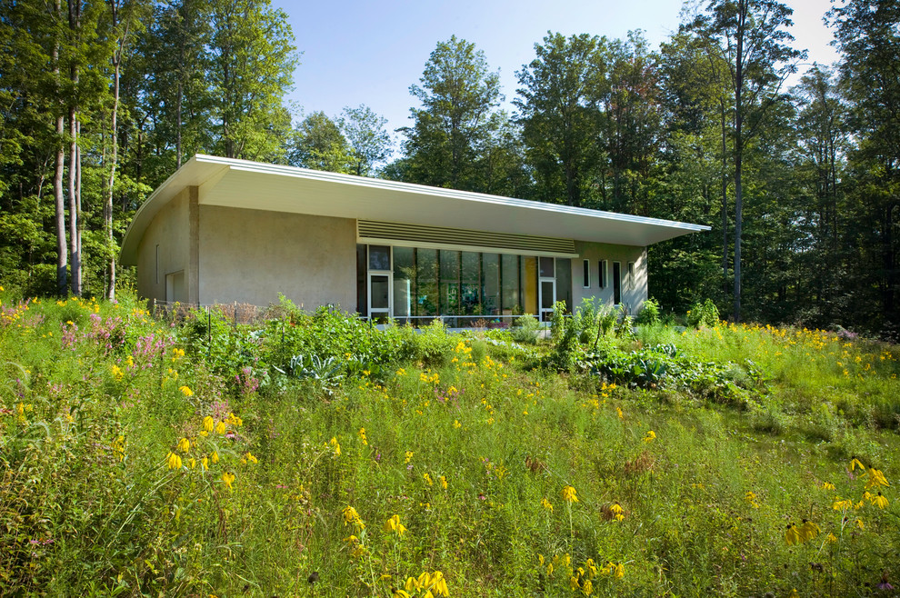 Esempio di un piccolo giardino minimalista esposto in pieno sole davanti casa in estate con pavimentazioni in cemento