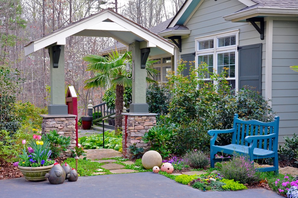 Foto di un giardino boho chic in ombra di medie dimensioni e davanti casa con pedane e un giardino in vaso