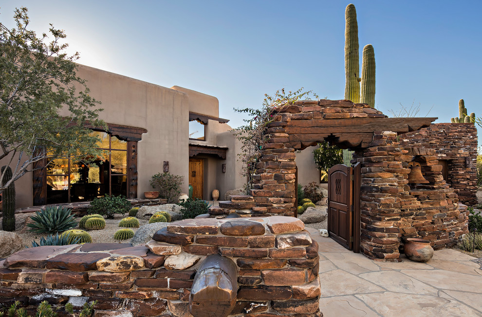 Photo of a front xeriscape garden in Phoenix with a garden path.