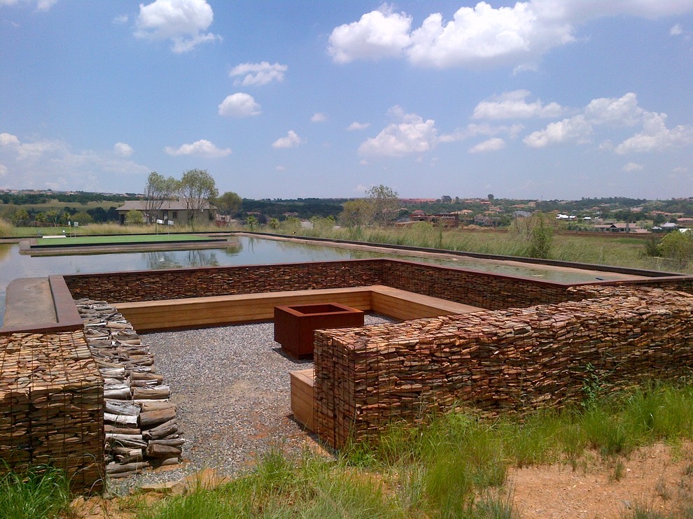 This is an example of a contemporary gravel water fountain landscape in Other.