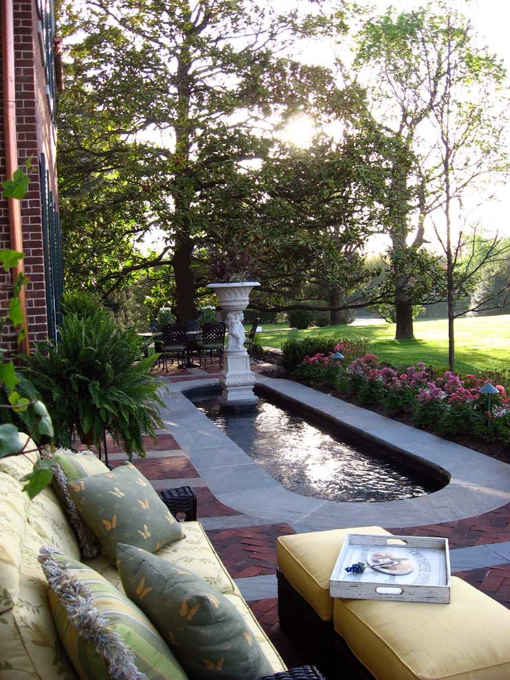 Photo of a small traditional brick water fountain landscape in New York.