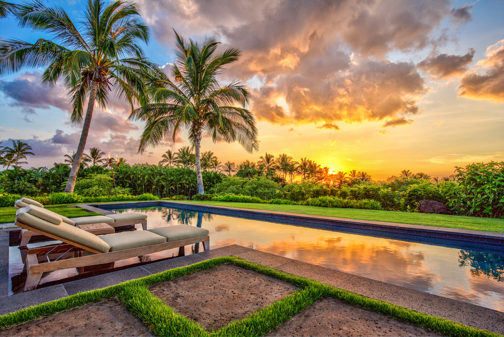 Design ideas for a large tropical backyard concrete paver landscaping in Hawaii.