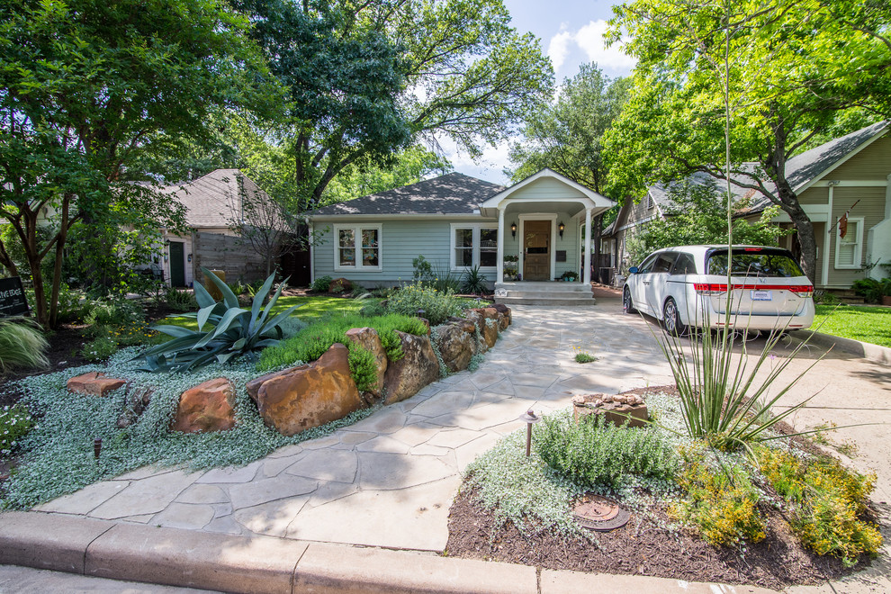 This is an example of a medium sized modern front xeriscape garden in Austin.