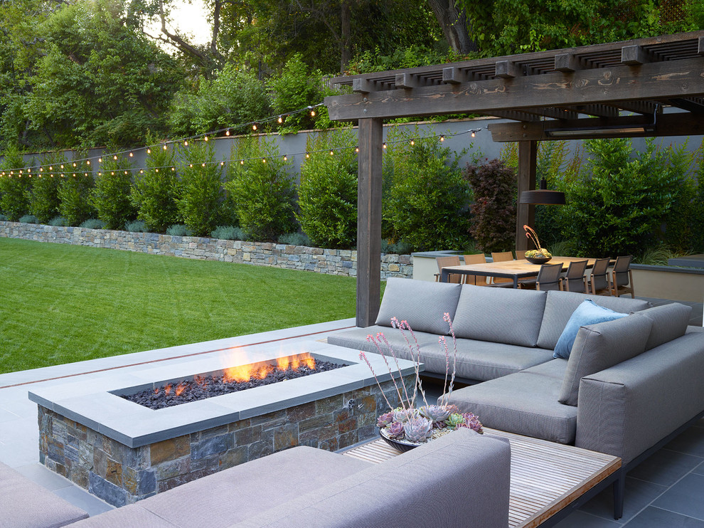 Design ideas for a large modern full sun front yard stone formal garden in San Francisco with a fire pit.
