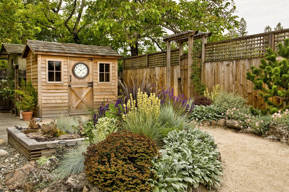 Photo of a rural full sun garden in Other with gravel.
