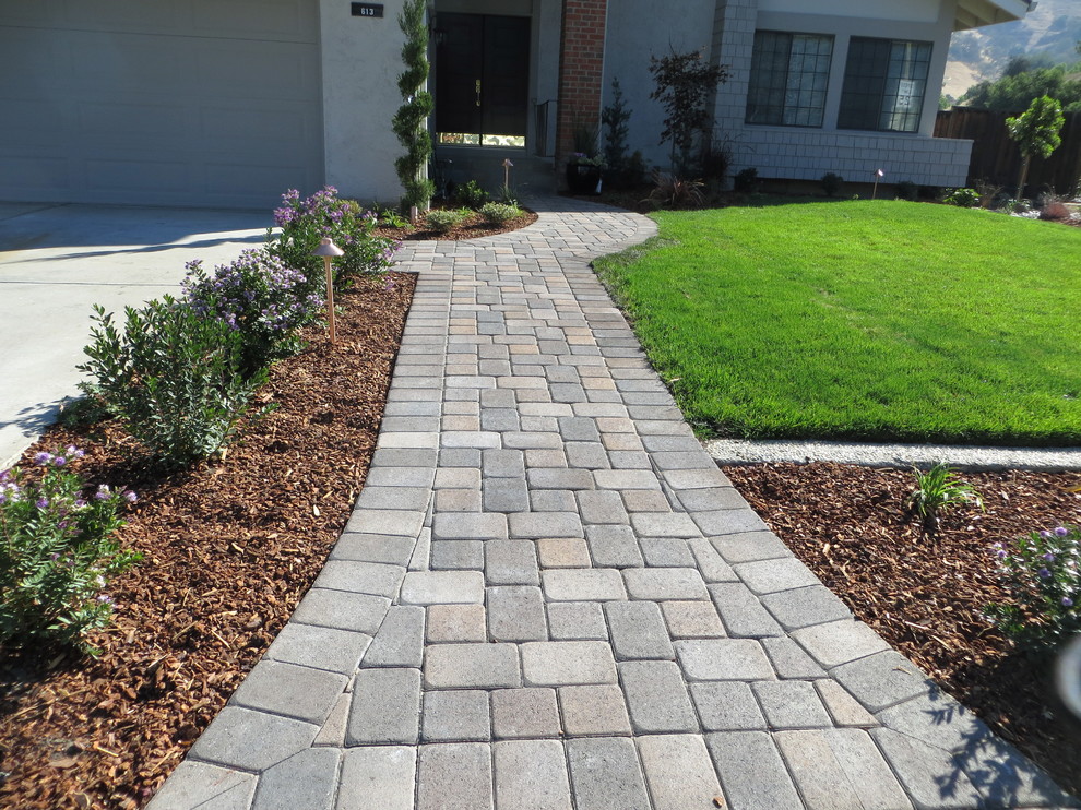 Design ideas for a large classic front driveway garden in San Francisco with concrete paving.