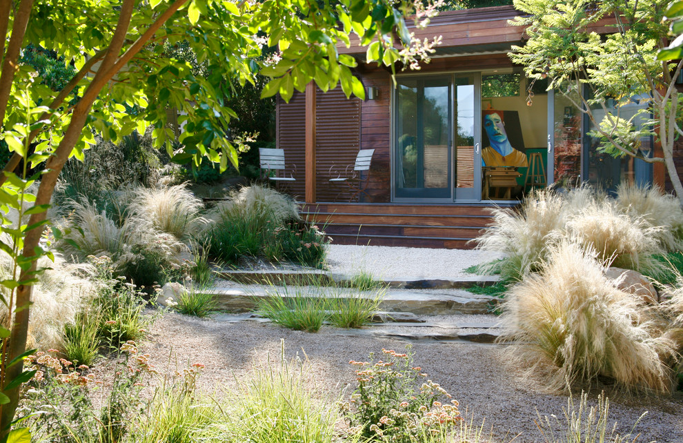 Photo of a large contemporary drought-tolerant and full sun backyard gravel landscaping in Santa Barbara.