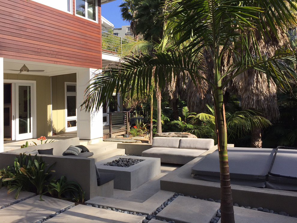 Patio - mid-sized contemporary backyard concrete paver patio idea in Orange County with a fire pit
