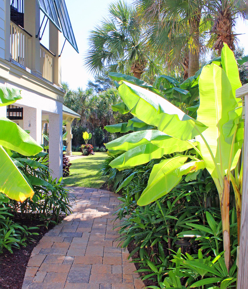 Design ideas for a mid-sized coastal partial sun side yard brick garden path in Charleston.