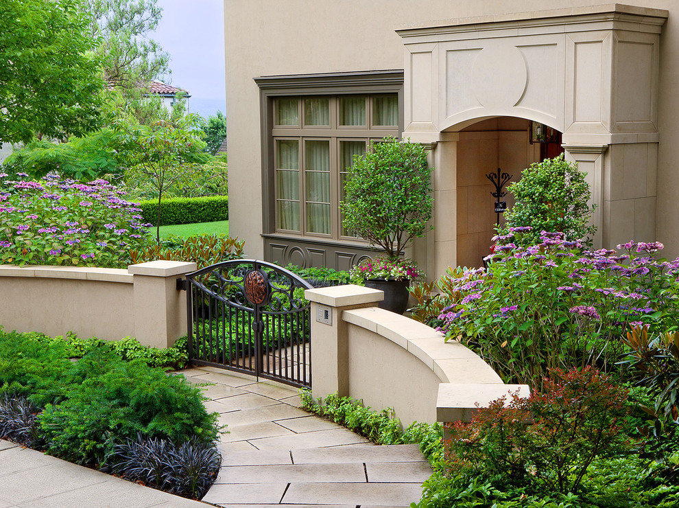 Design ideas for a mediterranean front garden in Seattle with natural stone paving.